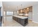 Open kitchen with a large island and modern lighting at 7348 W County Road 600 Rd # 12-604, McCordsville, IN 46055