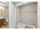 Small laundry room with washer and dryer hookups next to a bathroom at 7348 W County Road 600 Rd # 12-604, McCordsville, IN 46055