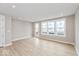 Bright living room with a door leading to a backyard at 7348 W County Road 600 Rd # 12-604, McCordsville, IN 46055