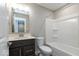 Cozy bathroom with a vanity with sink, toilet, and shower-tub combination at 7352 W County Road 600, McCordsville, IN 46055
