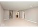Spacious bedroom with neutral carpet, recessed lights, and three doorways to other rooms at 7352 W County Road 600, McCordsville, IN 46055
