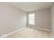 Well-lit bedroom with neutral carpet, recessed lighting, and a bright window at 7352 W County Road 600, McCordsville, IN 46055