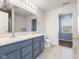 Bathroom featuring double sinks and a window, recently refreshed at 800 Gondola Run, Greenfield, IN 46140