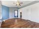 Bedroom featuring hardwood floors, a ceiling fan and an ensuite bathroom at 800 Gondola Run, Greenfield, IN 46140