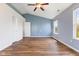 Bright bedroom with hardwood floors, a window and a ceiling fan at 800 Gondola Run, Greenfield, IN 46140