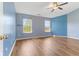 Bedroom with hardwood floors, two windows, a ceiling fan and a closet at 800 Gondola Run, Greenfield, IN 46140