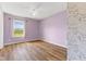 Bedroom with hardwood floors, a window and a ceiling fan at 800 Gondola Run, Greenfield, IN 46140