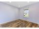 Bright bedroom with wood flooring and natural light from the exterior window at 800 Gondola Run, Greenfield, IN 46140