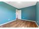 Freshly painted bedroom with hardwood floors, a window and closet at 800 Gondola Run, Greenfield, IN 46140