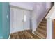 Welcoming entryway features hardwood floors and staircase leading to the upper level at 800 Gondola Run, Greenfield, IN 46140