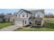 Two-story house with a brick facade, attached garage, and landscaping at 800 Gondola Run, Greenfield, IN 46140