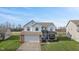 Two-story house with a brick facade, attached garage, and well-maintained lawn at 800 Gondola Run, Greenfield, IN 46140