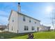 Two-story house with vinyl siding, firepit, and grassy backyard at 800 Gondola Run, Greenfield, IN 46140