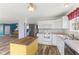 Bright kitchen with white cabinets, stainless steel appliances, and wood flooring at 800 Gondola Run, Greenfield, IN 46140
