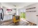 Modern kitchen with wood flooring, white cabinets, and a sliding door leading to the outdoors at 800 Gondola Run, Greenfield, IN 46140
