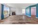 Open-concept living room with wood flooring, a fireplace, and plenty of natural light at 800 Gondola Run, Greenfield, IN 46140