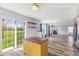 Open-concept living room with hardwood floors, fireplace, and sliding glass door to backyard at 800 Gondola Run, Greenfield, IN 46140