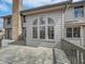 Spacious back deck featuring a brick chimney and unique arched windows, perfect for outdoor entertaining at 1242 Bitterwood Ct, Columbus, IN 47201