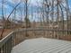 A beautiful, gray-toned back deck features a wooded lot view at 1242 Bitterwood Ct, Columbus, IN 47201