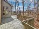 Home's back deck offers a secluded setting backing to a wooded area at 1242 Bitterwood Ct, Columbus, IN 47201