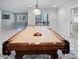 Finished basement billiard room featuring neutral paint, unique carpet, and billiard table at 1242 Bitterwood Ct, Columbus, IN 47201