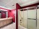 Basement bathroom showcasing a shower with sliding doors and a double sink vanity at 1242 Bitterwood Ct, Columbus, IN 47201