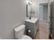 Modern half-bathroom features a sleek vanity and updated fixtures at 1242 Bitterwood Ct, Columbus, IN 47201