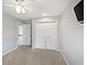 Bright bedroom showcasing carpet, a ceiling fan, and a closet at 1242 Bitterwood Ct, Columbus, IN 47201