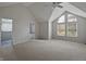 Spacious bedroom with vaulted ceiling and large windows, providing ample natural light at 1242 Bitterwood Ct, Columbus, IN 47201