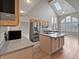 Bright kitchen featuring light wood cabinetry, an island, and stainless steel appliances at 1242 Bitterwood Ct, Columbus, IN 47201