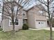 Two-story home featuring a combination of siding and brick, an attached garage, and a well-maintained lawn at 15314 Clear St, Noblesville, IN 46060