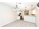 Bright dining room with elegant lighting and an open kitchen area at 4007 Bullfinch Way, Westfield, IN 46062