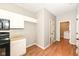 A functional kitchen area features a range, storage, and direct access to the laundry room at 4007 Bullfinch Way, Westfield, IN 46062