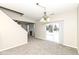 Bright living room features a cozy fireplace, carpet flooring, and a sliding glass door to the backyard at 4007 Bullfinch Way, Westfield, IN 46062