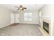 Open living room featuring a fireplace, large window, and neutral decor at 4007 Bullfinch Way, Westfield, IN 46062