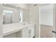 Bright bathroom with white cabinets and sink, and a shower with glass door at 67 Sterling Pl, New Whiteland, IN 46184