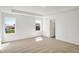 This bedroom offers natural light from two windows and neutral walls, carpet and trim at 67 Sterling Pl, New Whiteland, IN 46184