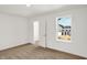 Cozy bedroom features a window with a view of the neighborhood and a spacious closet at 67 Sterling Pl, New Whiteland, IN 46184