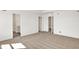 A carpeted bedroom features doors to the bathroom and hallway at 67 Sterling Pl, New Whiteland, IN 46184