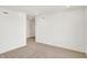 A carpeted bedroom has neutral walls and trim, recessed lights, and a door to a hallway at 67 Sterling Pl, New Whiteland, IN 46184