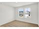 Bedroom featuring carpet, natural light and two windows overlooking houses at 67 Sterling Pl, New Whiteland, IN 46184