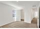 Well-lit bedroom showcasing a closet, window, and doorway leading to the hallway at 67 Sterling Pl, New Whiteland, IN 46184