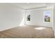 A sunlit bedroom features neutral decor, two windows, and a tray ceiling at 67 Sterling Pl, New Whiteland, IN 46184