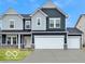 Charming two-story home with a two-car garage and stylish blue and gray siding at 67 Sterling Pl, New Whiteland, IN 46184