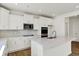 Well-lit kitchen features an island, stainless steel appliances, quartz countertops and stylish backsplash at 67 Sterling Pl, New Whiteland, IN 46184