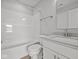 Bathroom with tub, toilet, and vanity sink, offering a clean, modern, and functional design at 10603 Banyan Wood Ct, Indianapolis, IN 46239