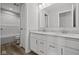 Bathroom featuring dual sinks, large vanity and a door into the toilet/shower area at 10603 Banyan Wood Ct, Indianapolis, IN 46239