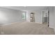 Open bedroom featuring a view of the bathroom with stand alone tub and a stairwell at 10603 Banyan Wood Ct, Indianapolis, IN 46239