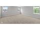Finished bedroom with carpet, a view to the outdoors, and new construction at 10603 Banyan Wood Ct, Indianapolis, IN 46239