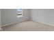 Bedroom featuring neutral carpet, one window and white base trim at 10603 Banyan Wood Ct, Indianapolis, IN 46239